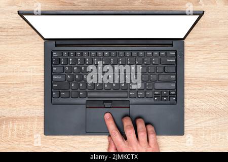 Hand working on a computer touchpad Stock Photo
