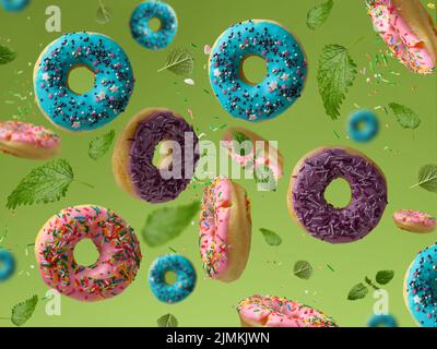 Sweet multicolored donuts levitate on a green background, sugar sprinkles are flying around Stock Photo