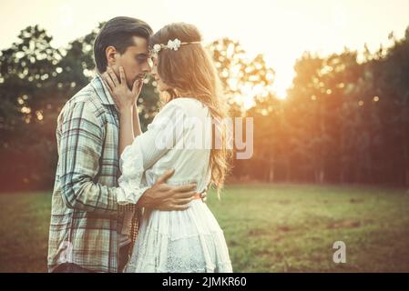 Portrait of young and beautiful couple at sunset Stock Photo