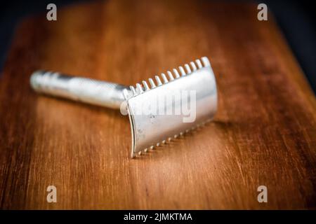 Old vintage shaver on a wooden background Stock Photo