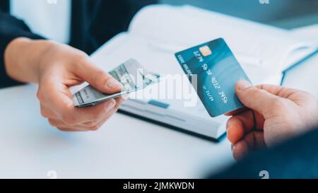 money transfer man exchanging credit card cash Stock Photo