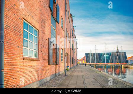 Old brick house on the embankment of the canal leading to the Five Circles Pedestrian Bridge. Copenhagen, Denmark Stock Photo