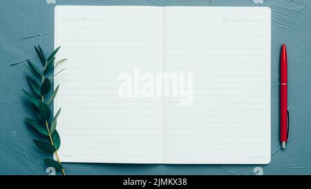 open empty notebook personal journal green sprig Stock Photo