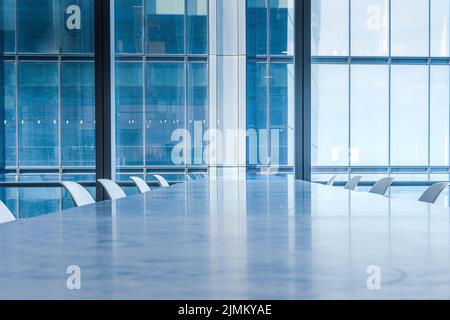 A conference meeting room in a glass building Stock Photo