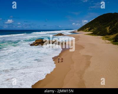 St Lucia South Africa, Rocks sand ocean, and blue coastal skyline at Mission Rocks beach near Cape Vidal in Isimangaliso Wetland Stock Photo