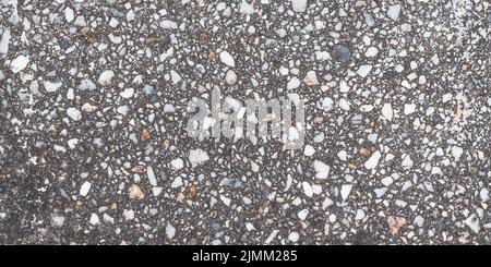 Granite texture, natural gray pattern of tiles floor for design, grainy surface of pavement. Abstract dark stones background. Old weathered urban wall Stock Photo