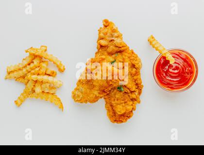 Top view fish piece chips with ketchup Stock Photo