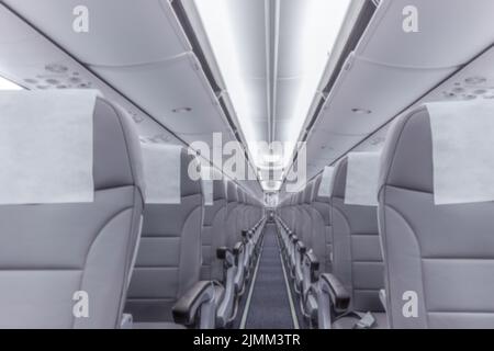Perspective view of empty aircraft seats and lights Stock Photo