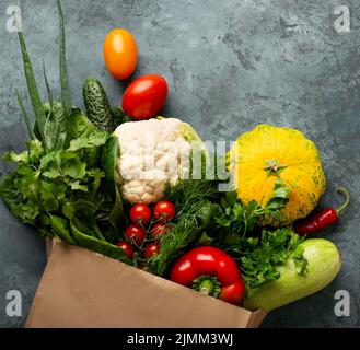 Flat lay vegetables stucco background Stock Photo
