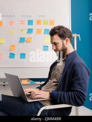 Bearded man working laptop Stock Photo