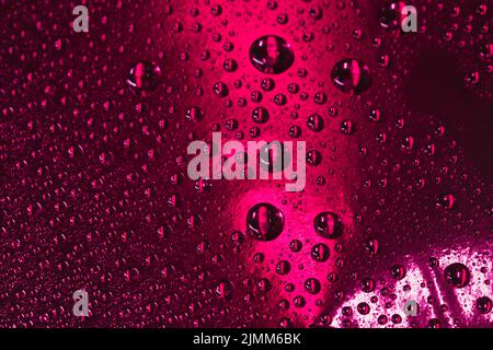 Abstract burgundy background with water drops Stock Photo