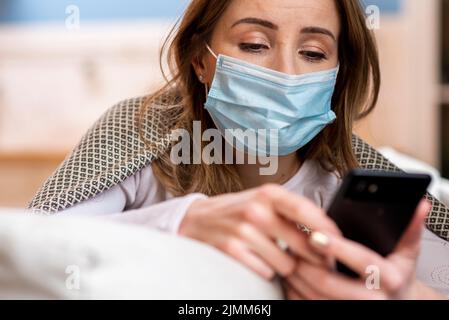 Quarantine daily activities woman her mobile phone Stock Photo