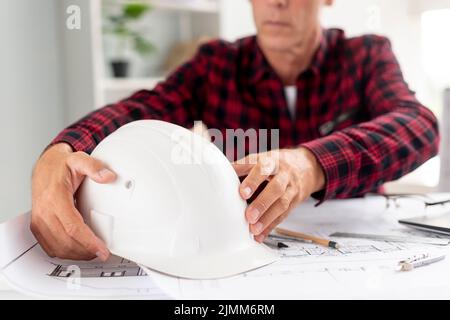 Architect holding his safety helmet Stock Photo