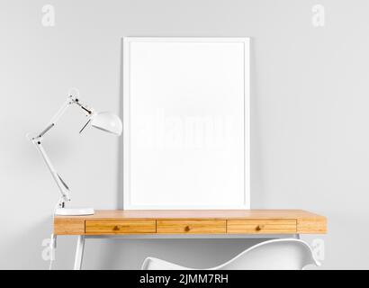 Frame mock up table beside lamp Stock Photo