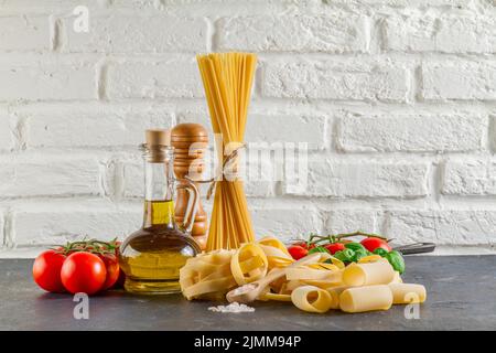 Surface with different types pasta tomatoes oil Stock Photo