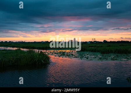 Purple sunset over the Dutch watery landscape in the vicinity of Gouda, Holland Stock Photo