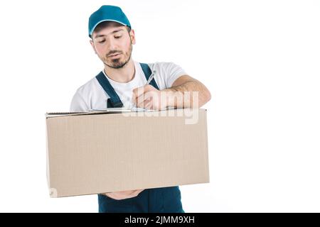 Deliveryman with parcel writing clipboard Stock Photo