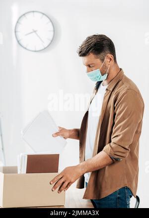 Medium shot man wearing medical mask Stock Photo