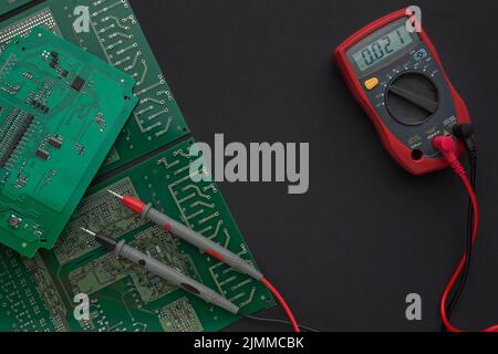 Close up circuit board with multimeter Stock Photo