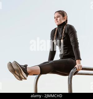 Side view athletic woman exercising outdoors Stock Photo