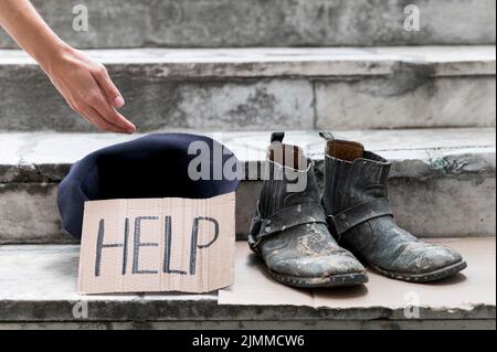 Homeless person begging help Stock Photo