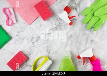 Flat lay arrangement with cleaning items marble table Stock Photo