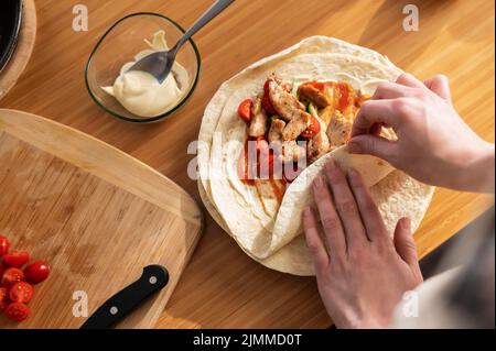 Close up hands preparing food Stock Photo