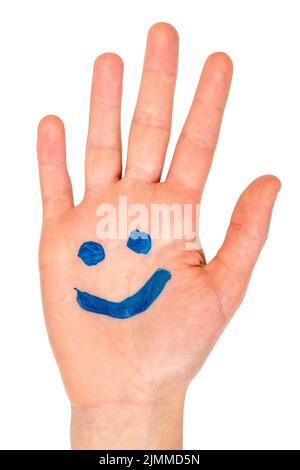 Blue smiling face drawn on child palm Stock Photo