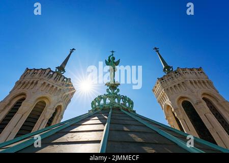 View of Saint-Michel statue on the top of notre-dame-de-Fourviere basilica in Lyon, France Stock Photo