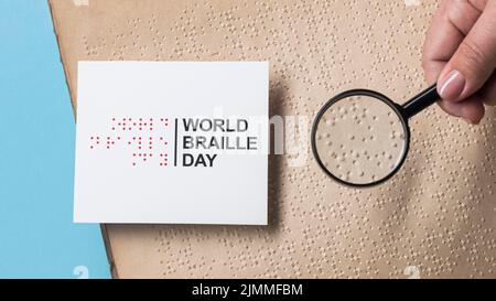 Close up hand holding magnifying glass Stock Photo