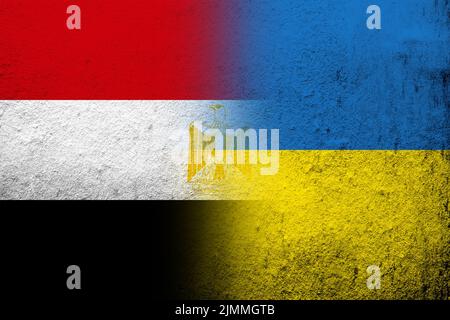 The Arab Republic of Egypt National flag with National flag of Ukraine. Grunge background Stock Photo