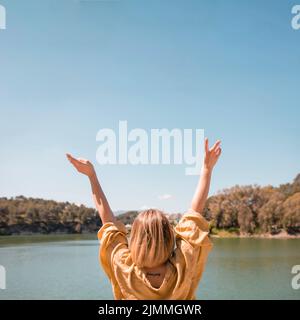 Faceless woman gesturing peace Stock Photo