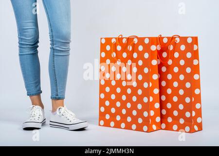 Close up shopping bags mock up near woman legs Stock Photo