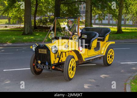 1954 50s fifties Siva Edwardian FORD 103E Popular. Dr Who BESSIE is a  fifties old-style replica open-topped sedan yellow KIT CAR. Tardis Roadster en route to Lytham Hall classic car show, Lancashire, UK Stock Photo