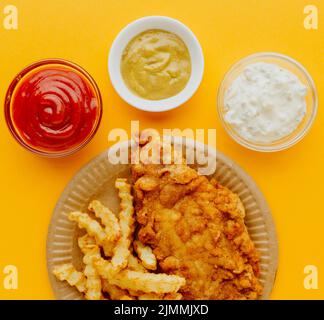 Top view fish chips plate with sauces Stock Photo