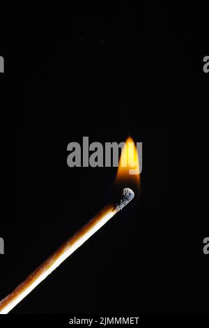 Wooden match on a black background Stock Photo