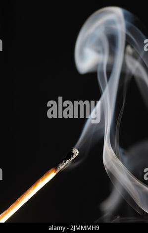 Wooden match on a black background Stock Photo