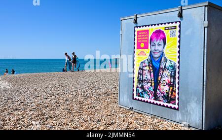 Brighton UK 7th August 2022 - A small army of volunteers help clean up brighton beach and seafront on a hot sunny day as thousands of visitors are in the city for the Pride Festival Weekend celebrations . More hot weather is forecast for parts of the UK over the next week with temperatures expected to go above 30 degrees again : Credit Simon Dack / Alamy Live News Stock Photo