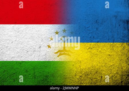 The Republic of Tajikistan National flag with National flag of Ukraine. Grunge background Stock Photo