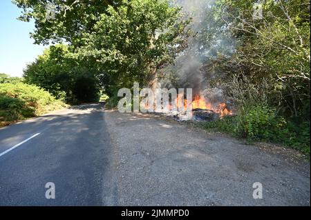 A wildfire by the side of the road in Ardingly, West Sussex during the drought condition's of the summer on the 07th August 2022 Stock Photo