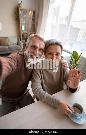 Adorable senior couple taking selfie Stock Photo