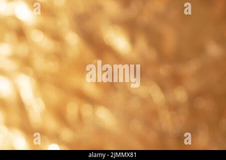 Abstract out of focus golden blurred metallic background Stock Photo