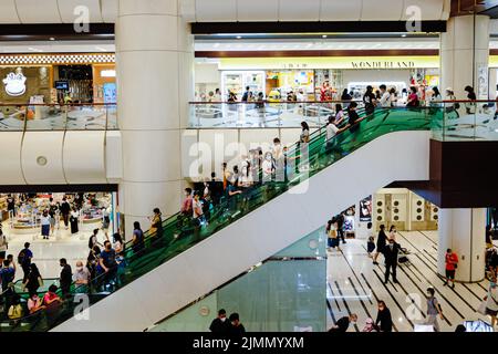 Hong Kong, China. 7th Aug, 2022. People wear face mask and shop in a shopper mall. A second round of government consumption vouchers released on Sunday, 6.2 million people received a HK$2,000 voucher with a further HK$3,000 due later in the year. (Credit Image: © Keith Tsuji/ZUMA Press Wire) Stock Photo