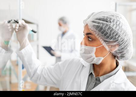 Close up scientist writing board Stock Photo