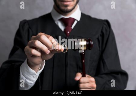 Close up judge with golden rings gavel Stock Photo