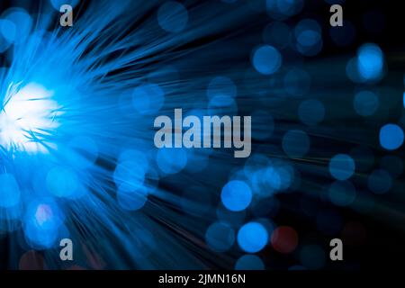 Bright light with blue optical fiber Stock Photo