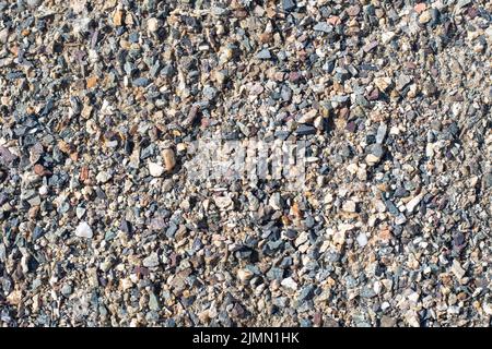 Background from crushed stone and sand. Small gravel stones. Stock Photo