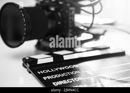 Modern black mirrorless camera rig and clapperboard Stock Photo