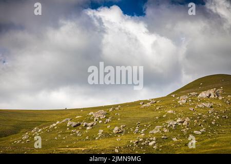 A man on a horse high in the mountains, the village of Galiat, North Ossetia Stock Photo