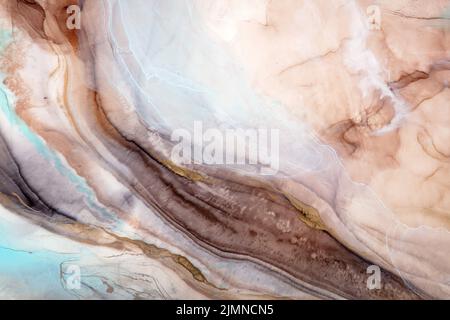 Abstract paint in light beige tones. Painted by alcohol ink. Stock Photo